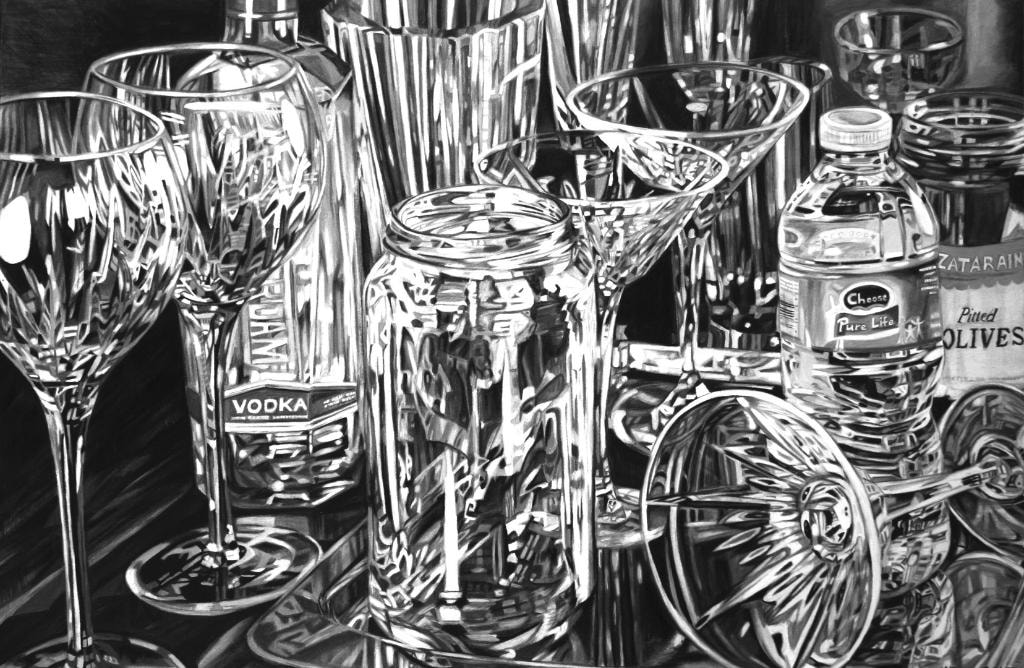 Black and white still life of glassware and bottles