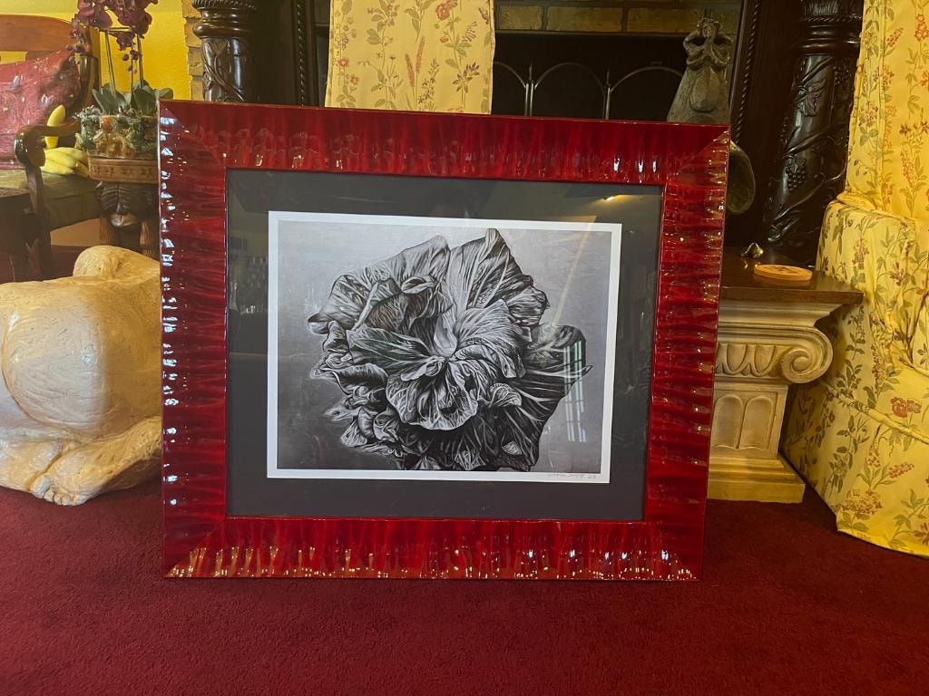 Black and white flower print in red frame